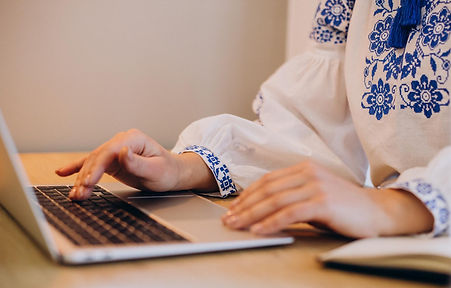 Image shows a hands on laptop of a tutor of ENGin Speak Ukrainian program